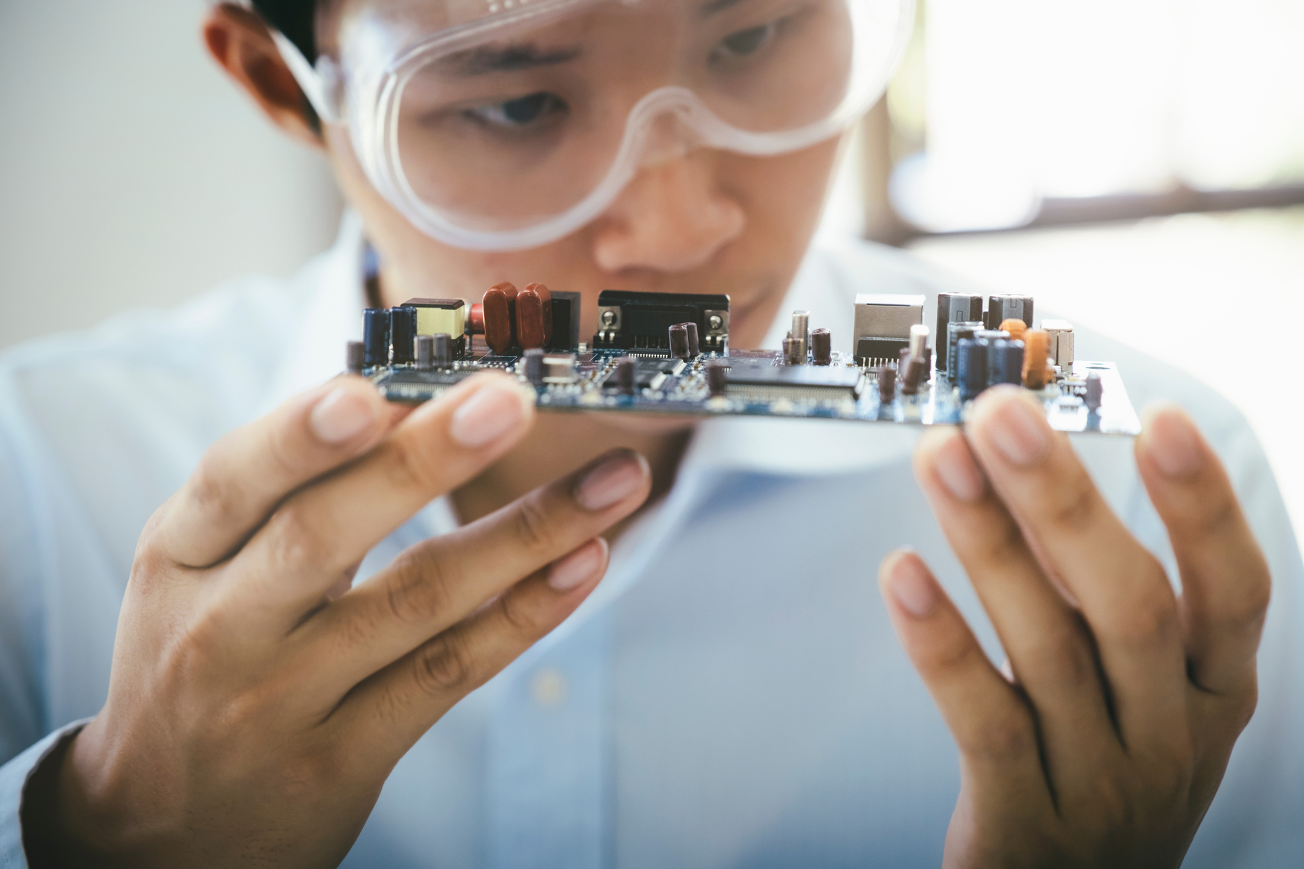 Technician Checking Electronic Device